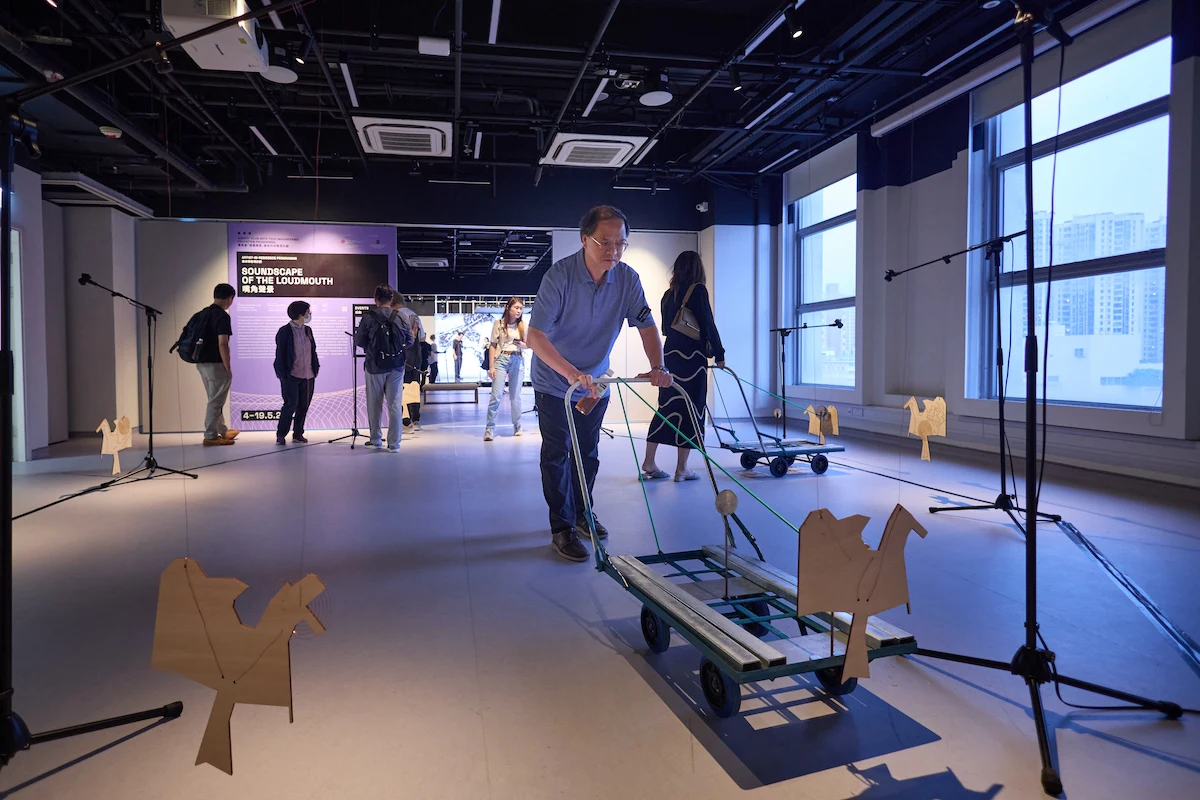 Visitors embark on a sonic journey through Tai Kok Tsui, pushes carts that carry the whispers of the community.