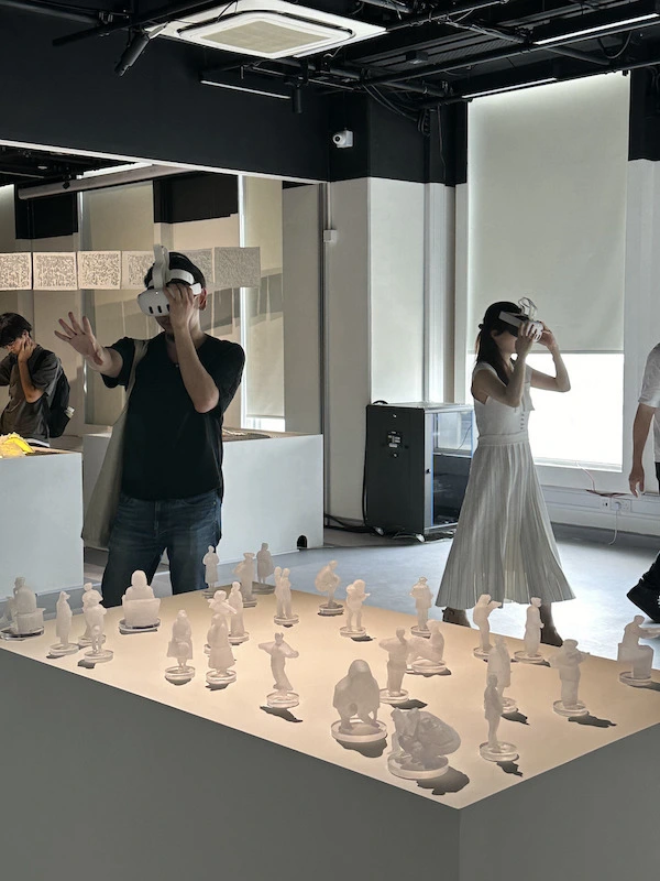 Viewers don VR headsets, stepping into Kachi Chan's "Gaze," an immersive world of interactive mixed reality.
