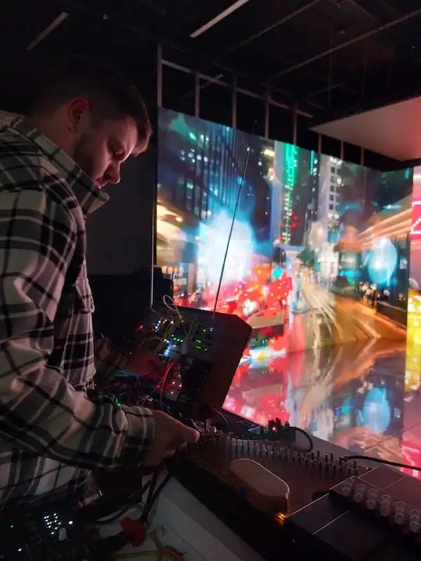 "Compound Eyes" and "Doomsday Booths." Images fractured and shifting, a kaleidoscope of visions, accompanied by hypnotic music, unveil a thousand Hong Kong stories, a myriad of urban tales.